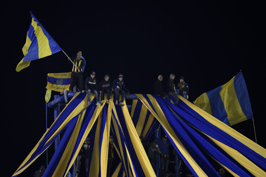 Argentina's Rosario Central supporters cheer for their team during the Copa Libertadores 2016 quarterfinals first leg football match against Colombia's Atletico Nacional at the "Gigante de Arroyito" stadium in Rosario, Santa Fe, Argentina, on May 12, 2016. / AFP / JUAN MABROMATA (Photo credit should read JUAN MABROMATA/AFP/Getty Images)