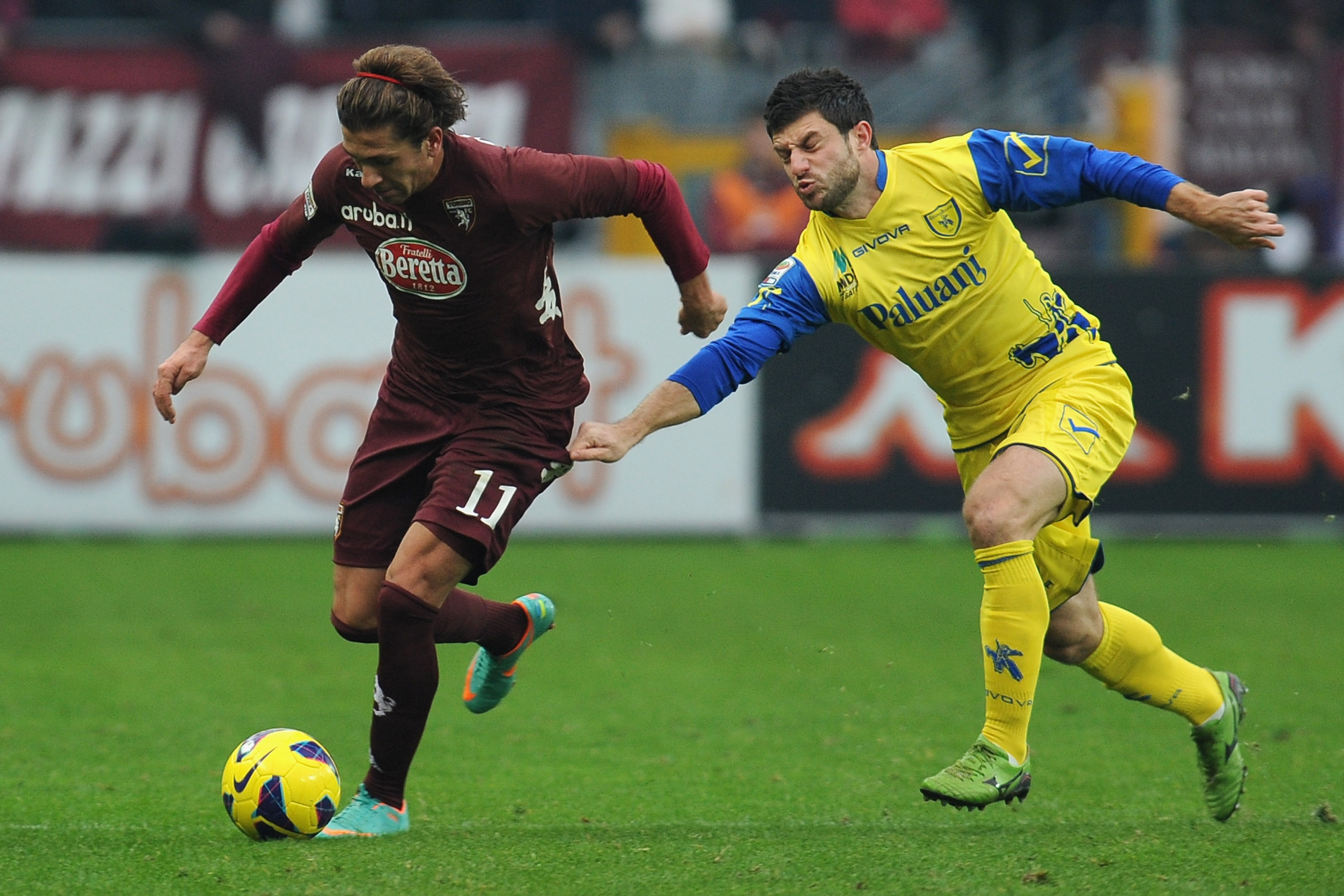 TURIN, ITALY - DECEMBER 22: Alessio Cerci (L) of Torino FC is challenged by Bojan Jokic of AC Chievo Verona during the Serie A match between Torino FC and AC Chievo Verona at Stadio Olimpico di Torino on December 22, 2012 in Turin, Italy. (Photo by Valerio Pennicino/Getty Images)