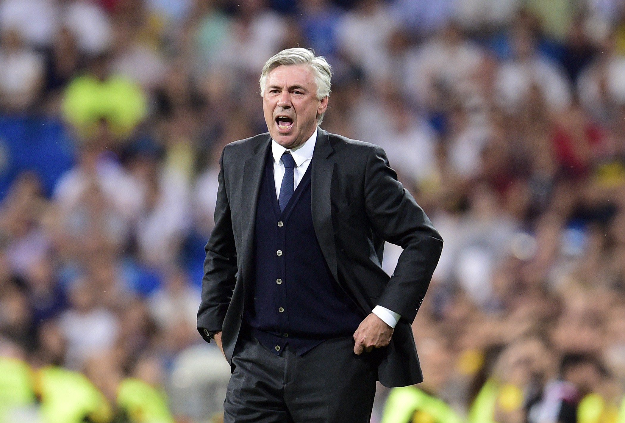 Real Madrid's Italian coach Carlo Ancelotti gestures during the Spanish league football match Real Madrid CF vs Valencia CF at the Santiago Bernabeu stadium in Madrid on May 9, 2015. The game ended with a draw 2-2. AFP PHOTO/ GERARD JULIEN (Photo credit should read GERARD JULIEN/AFP/Getty Images)