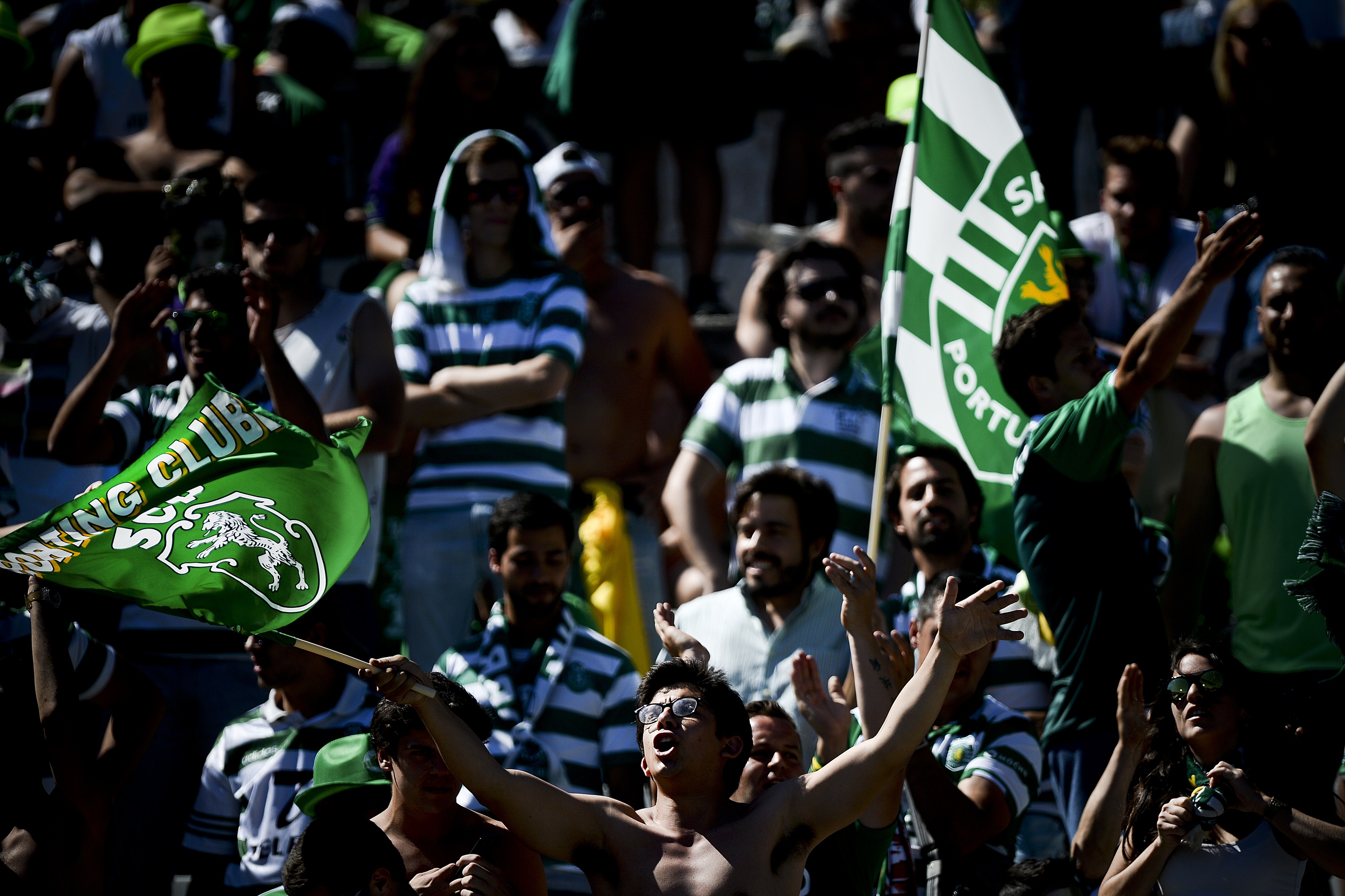 Sporting's supporters wave flags and shout slogans moments before the Taca de Portugal (Portuguese Cup) football match final Sporting CP vs SC Braga at Jamor stadium in Oeiras, outskirts of Lisbon on May 31, 2015. AFP PHOTO / PATRICIA DE MELO MOREIRA (Photo credit should read PATRICIA DE MELO MOREIRA/AFP/Getty Images)