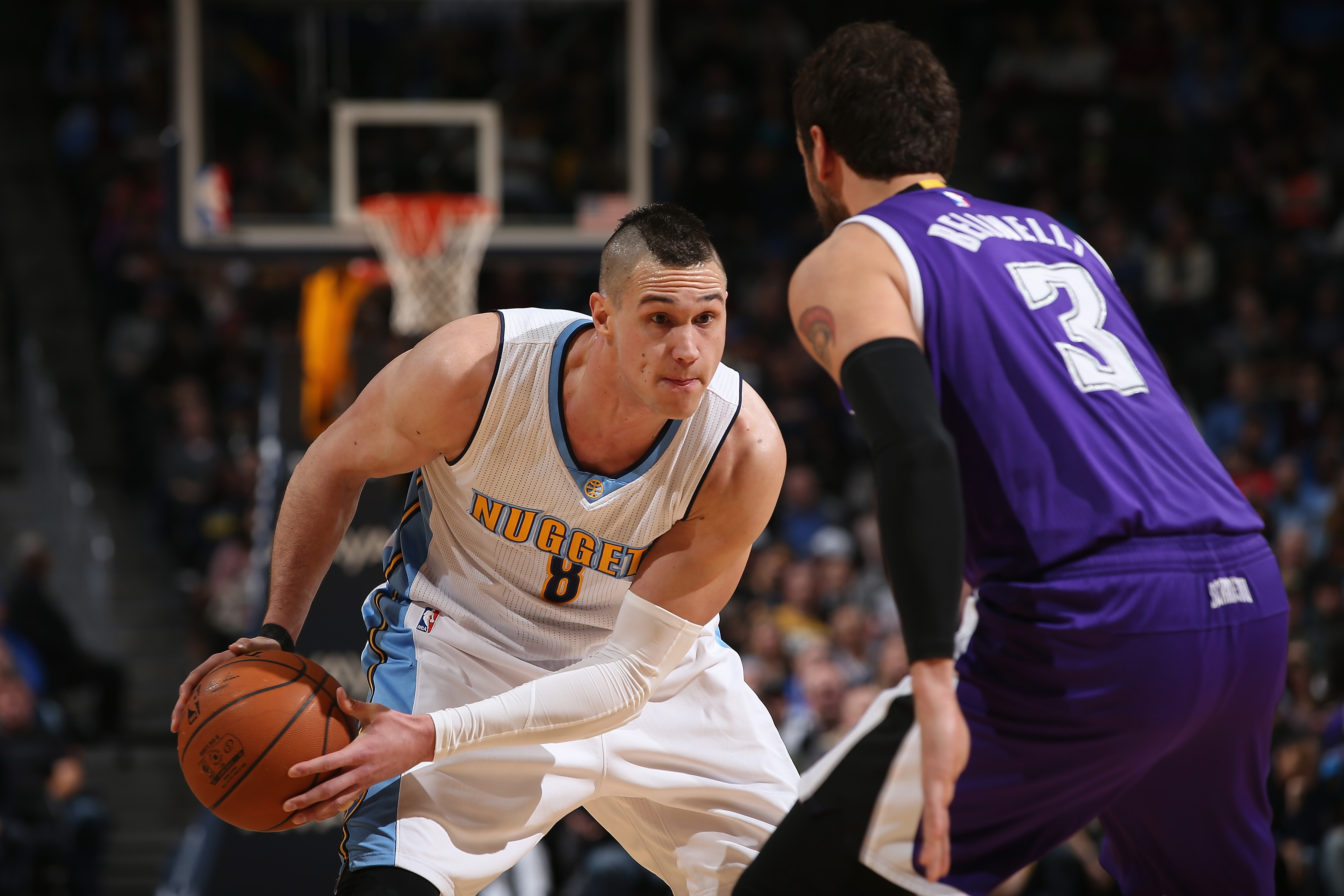 DENVER, CO - FEBRUARY 23: Danilo Gallinari #8 of the Denver Nuggets controls the ball against Marco Belinelli #3 of the Sacramento Kings at Pepsi Center on February 23, 2016 in Denver, Colorado. The Kings defeated the Nuggets 114-110. NOTE TO USER: User expressly acknowledges and agrees that, by downloading and or using this photograph, User is consenting to the terms and conditions of the Getty Images License Agreement. (Photo by Doug Pensinger/Getty Images)