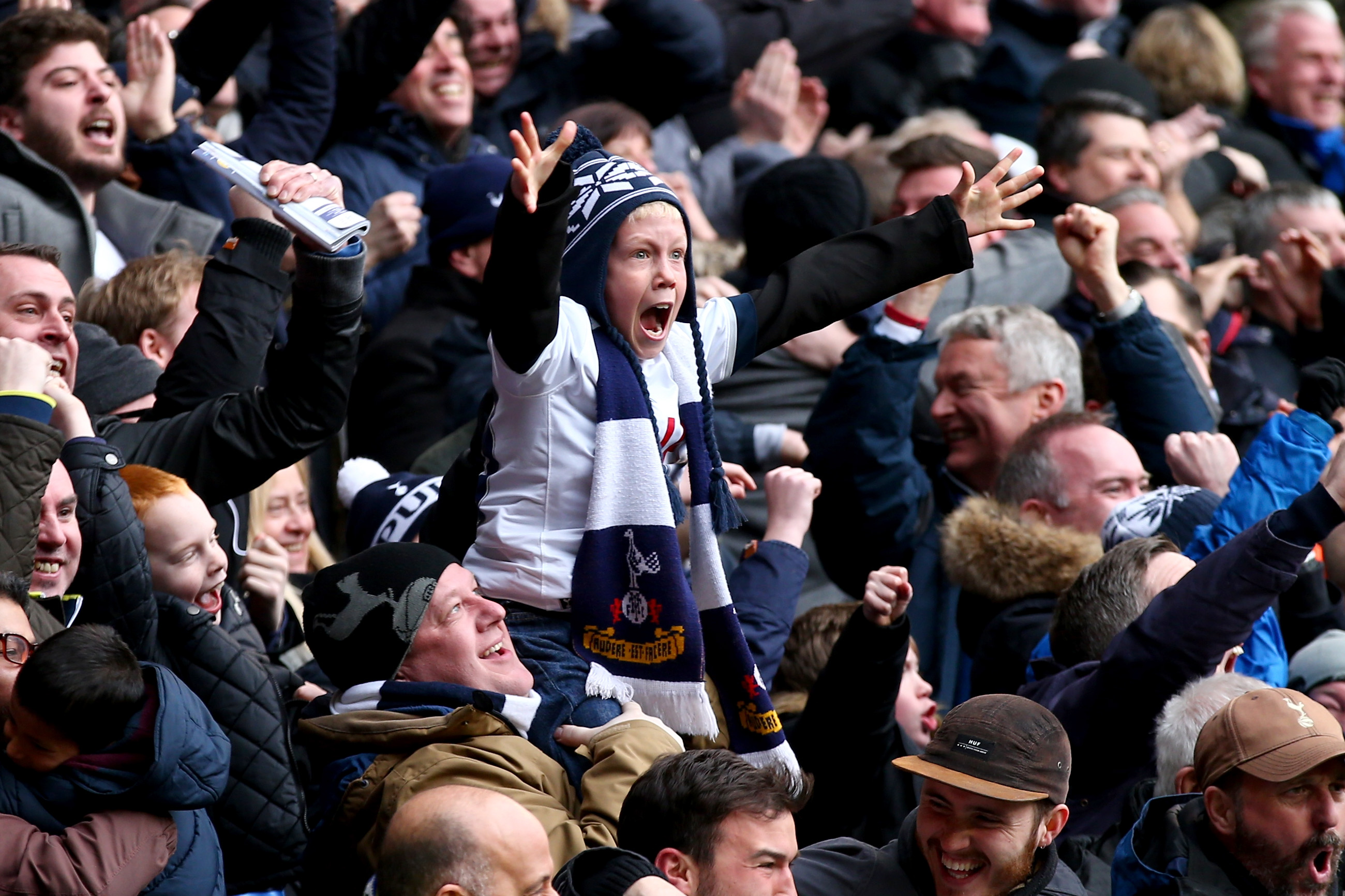 LONDON, ENGLAND - MARCH 05: A young Tottenham Hotspur supporter reacts after Harry Kane of Tottenham Hotspur scores his team's second goal during the Barclays Premier League match between Tottenham Hotspur and Arsenal at White Hart Lane on March 5, 2016 in London, England (Photo by Clive Rose/Getty Images)