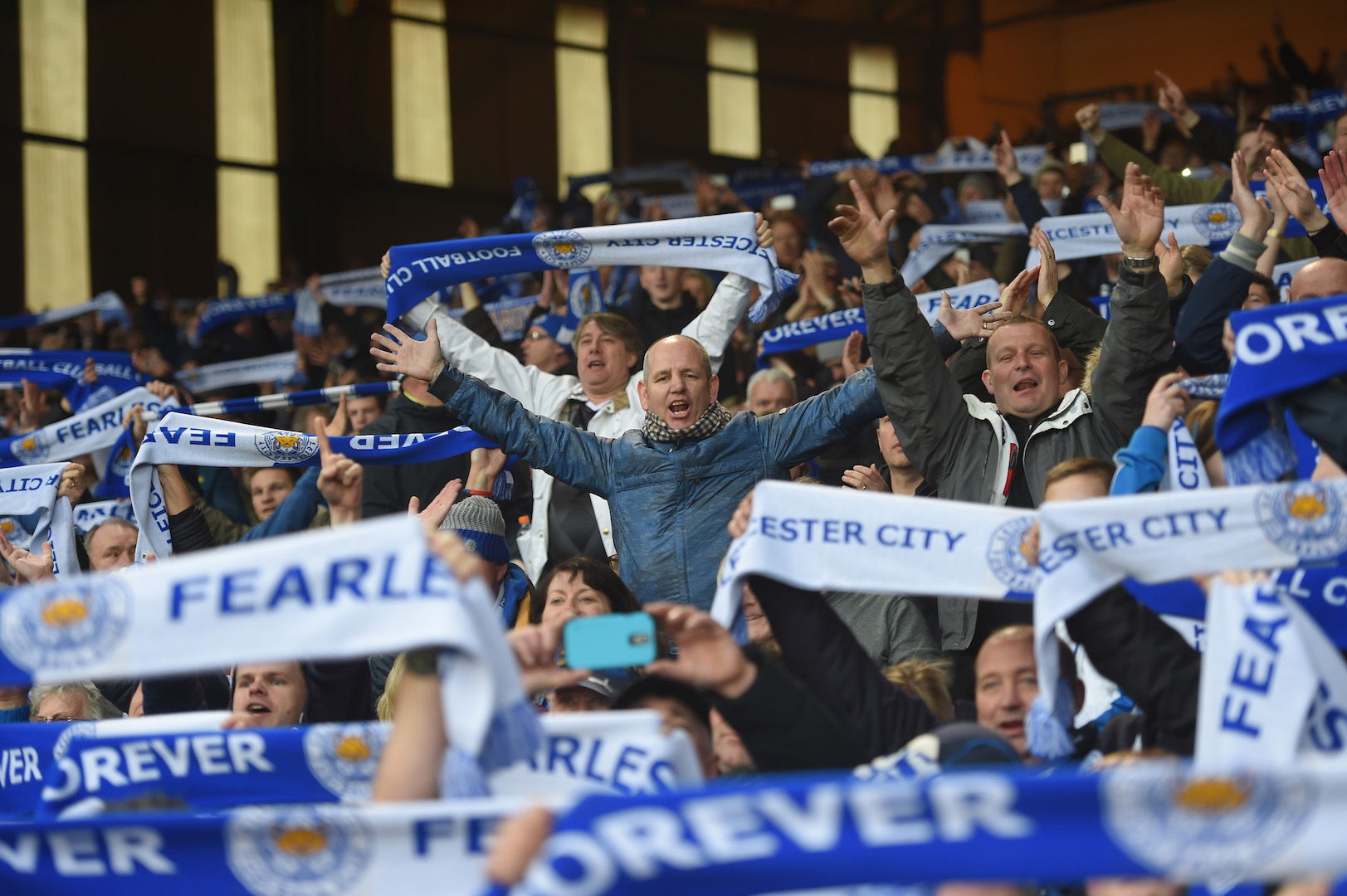 LONDON, ENGLAND - MARCH 19: Leicester City supporters celebrate their team's win after the Barclays Premier League match between Crystal Palace and Leicester City at Selhurst Park on March 19, 2016 in London, United Kingdom. (Photo by Michael Regan/Getty Images)