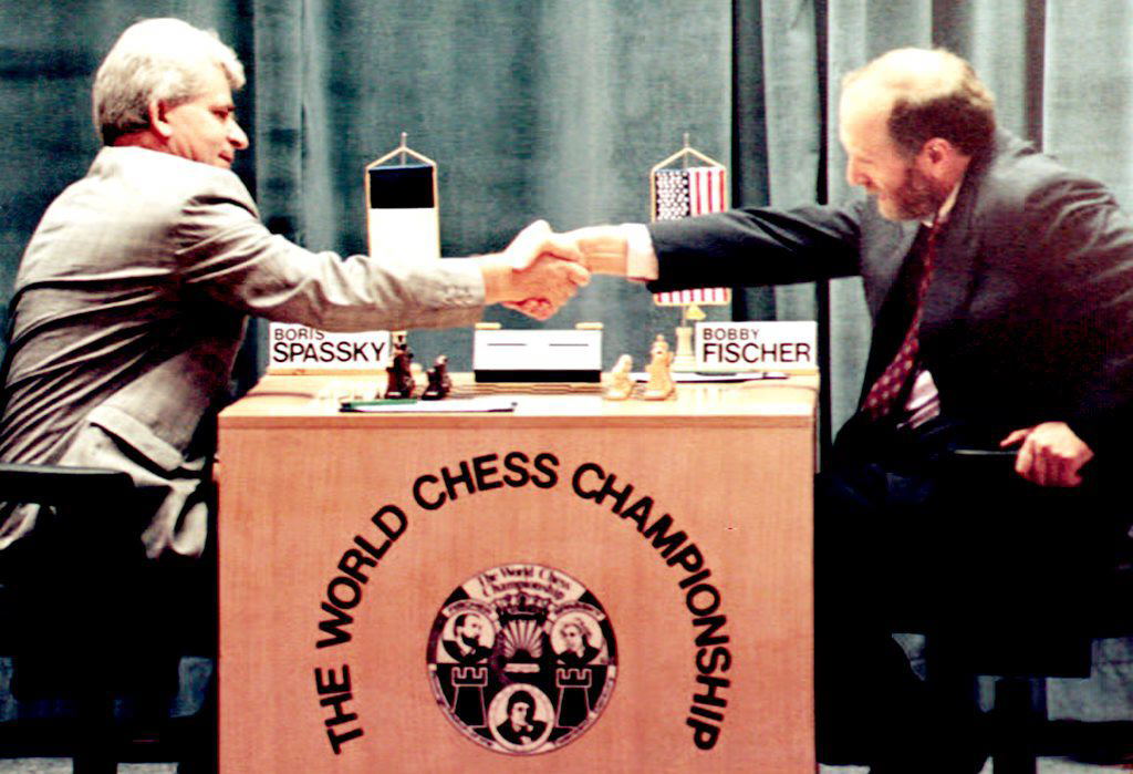 Russian-born chess master Boris Spassky (L) shakes