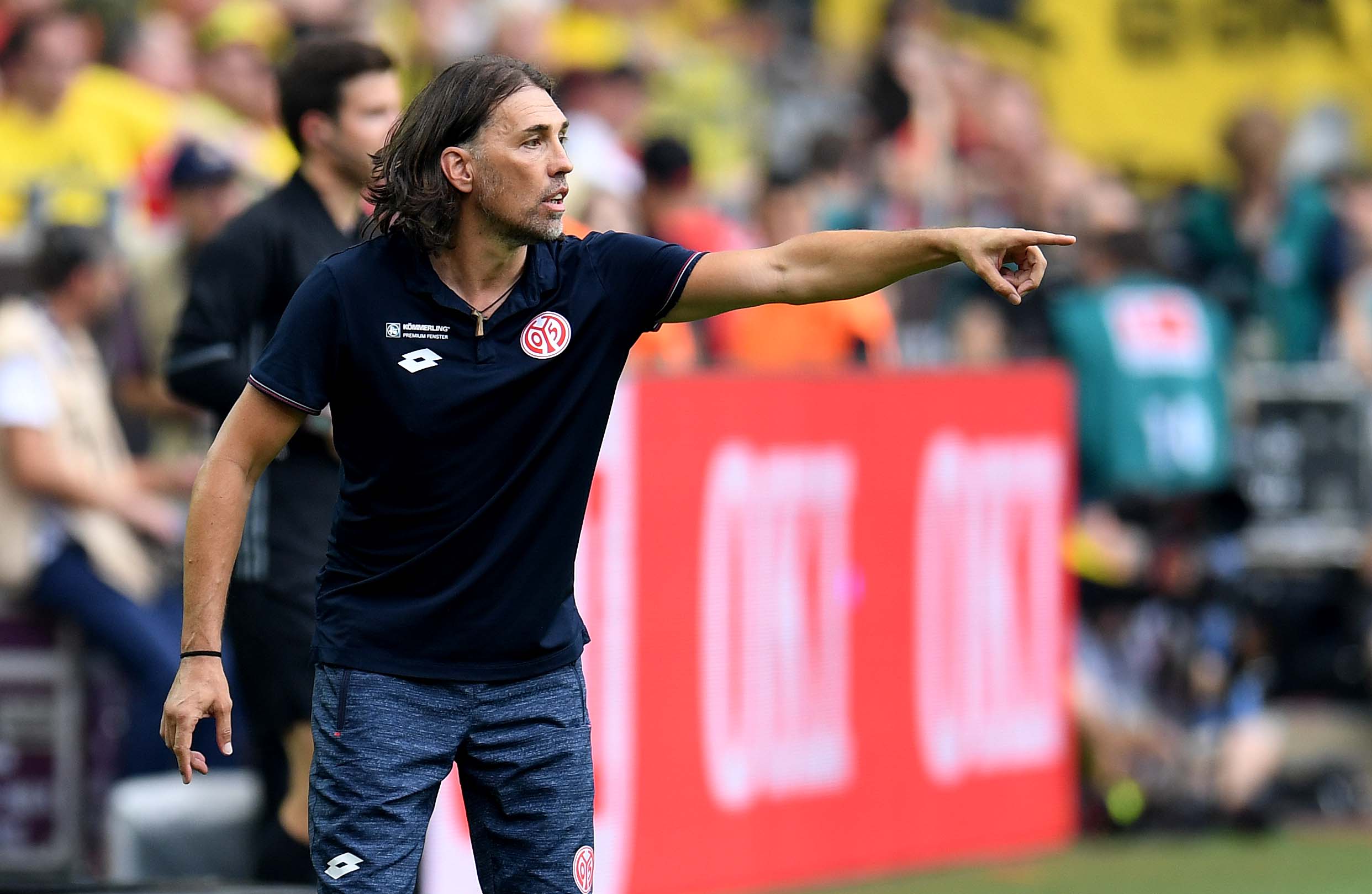 Mainz' Swiss head coach Martin Schmidt reacts during the German first division Bundesliga football match of Borussia Dortmund vs FSV Mainz 05 in Dortmund, western Germany, on August 27, 2016. / AFP / PATRIK STOLLARZ / RESTRICTIONS: DURING MATCH TIME: DFL RULES TO LIMIT THE ONLINE USAGE TO 15 PICTURES PER MATCH AND FORBID IMAGE SEQUENCES TO SIMULATE VIDEO. == RESTRICTED TO EDITORIAL USE == FOR FURTHER QUERIES PLEASE CONTACT DFL DIRECTLY AT + 49 69 650050 (Photo credit should read PATRIK STOLLARZ/AFP/Getty Images)