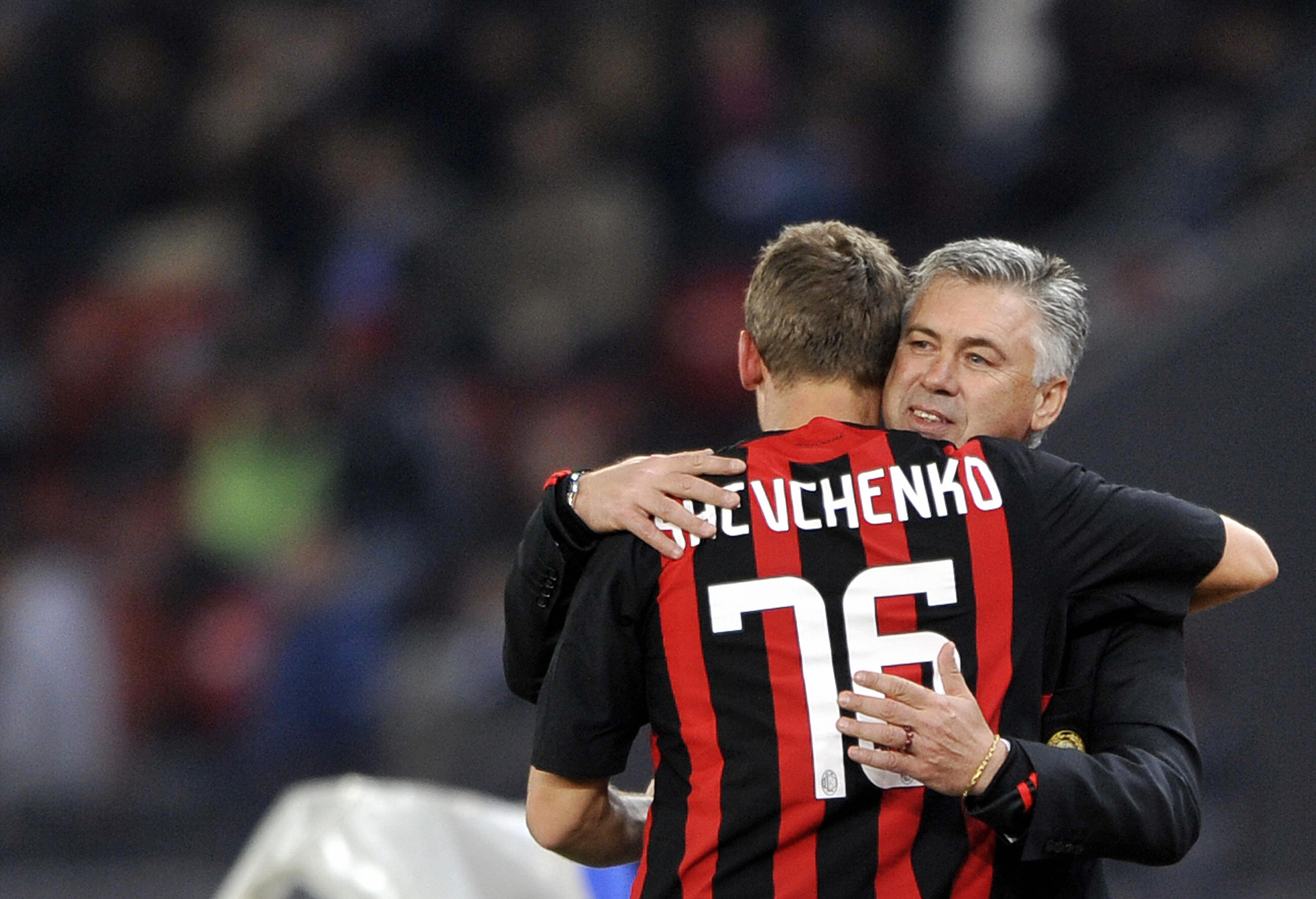 AC Milan's Andrei Shevchenko is congratulates by team coach Carlo Ancelotti after he scored the first goal during their UEFA Cup first round, second leg football game against FC Zurich on October 2, 2008 in Zurich. AFP PHOTO / FABRICE COFFRINI (Photo credit should read FABRICE COFFRINI/AFP/Getty Images)