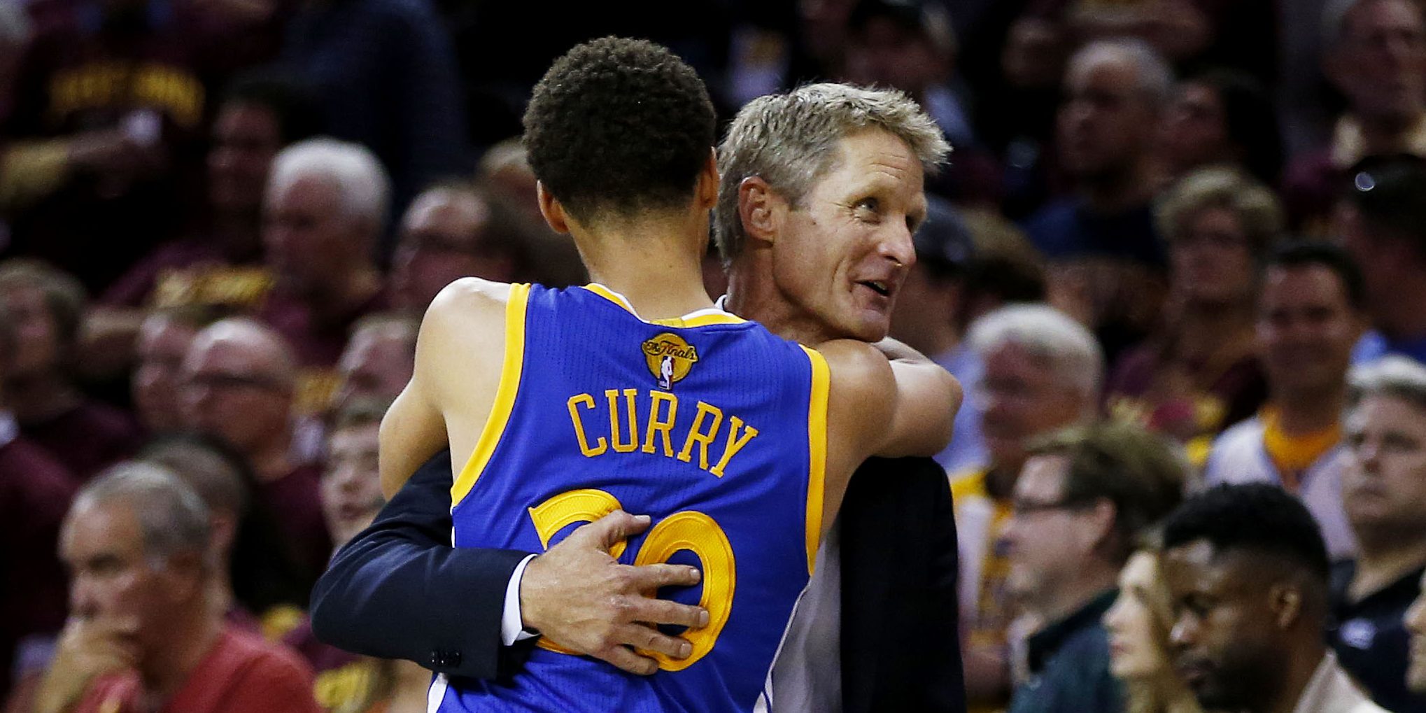 CLEVELAND, OH - JUNE 16: Stephen Curry #30 of the Golden State Warriors celebrates with head coach Steve Kerr after they defeated the Cleveland Cavaliers 105 to 97 in Game Six of the 2015 NBA Finals at Quicken Loans Arena on June 16, 2015 in Cleveland, Ohio. NOTE TO USER: User expressly acknowledges and agrees that, by downloading and or using this photograph, user is consenting to the terms and conditions of Getty Images License Agreement. (Photo by Ezra Shaw/Getty Images)