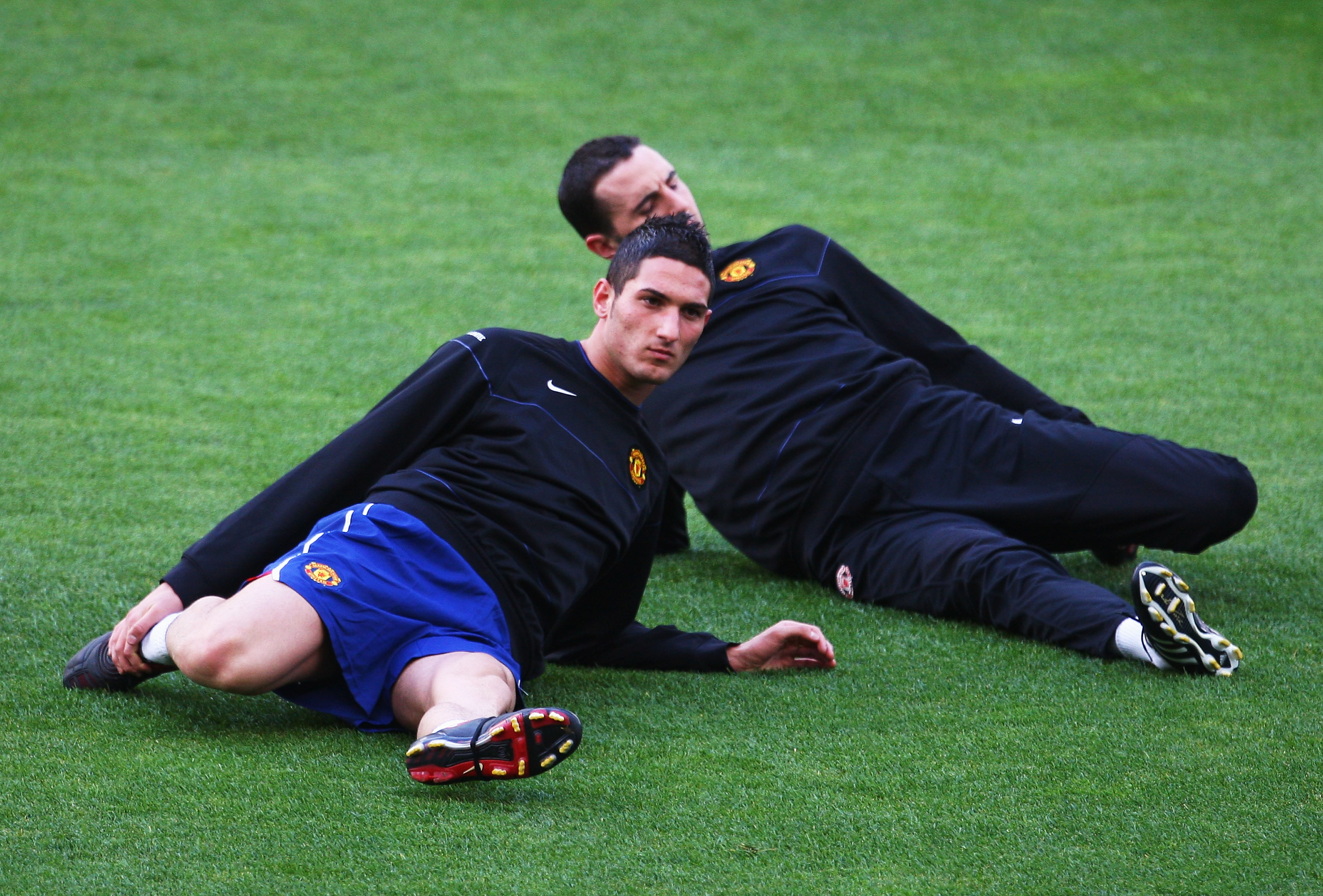 PORTO, PORTUGAL - APRIL 14: Federico Macheda and John O'Shea stretch during the Manchester United Training Session prior to their UEFA Champions League Quarter Final second leg match with FC Porto at the Estadio do Dragao on April 14, 2009 in Porto, Portugal. (Photo by Laurence Griffiths/Getty Images)