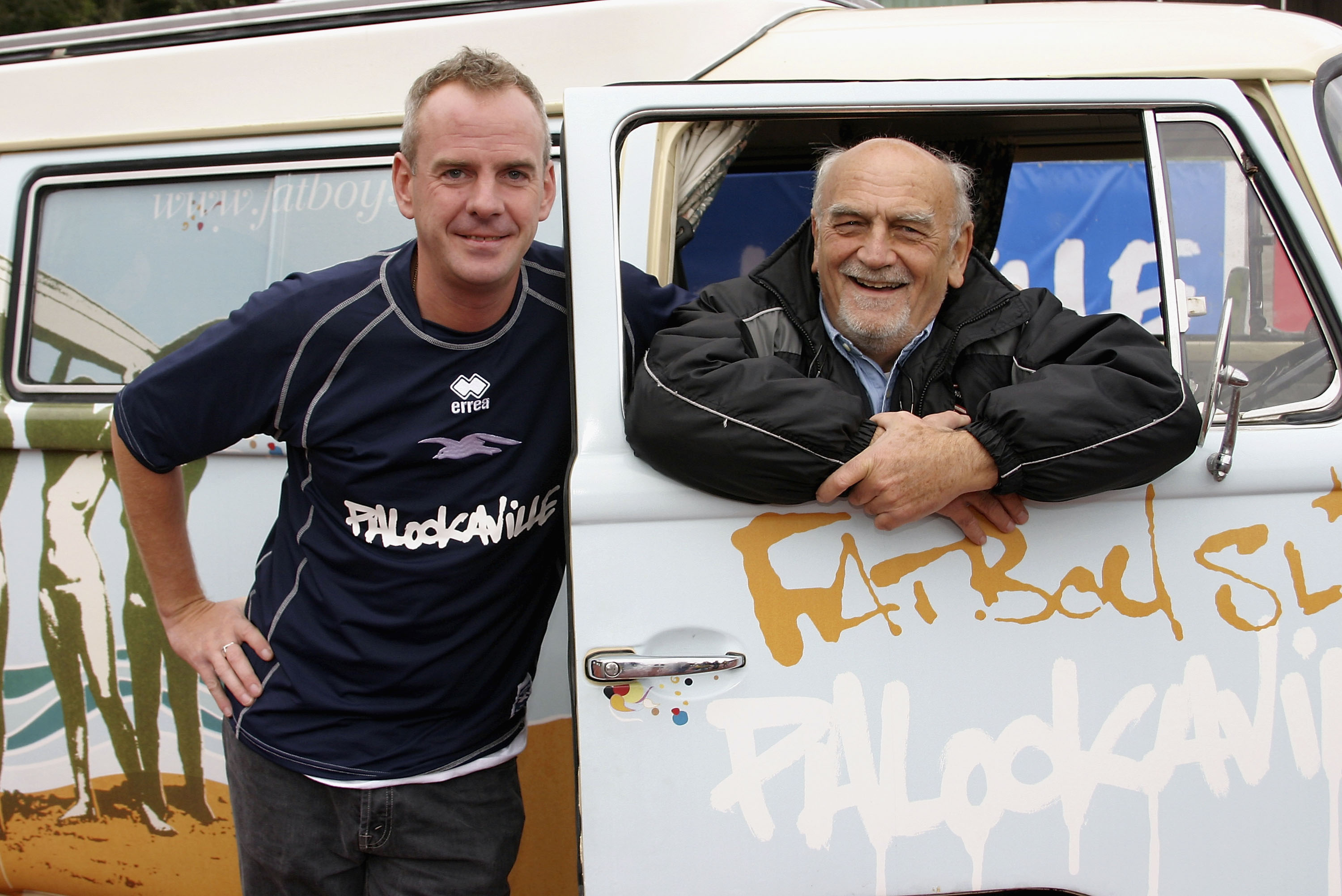 BRIGHTON, ENGLAND - OCTOBER 2: DJ and Brighton and Hove Albion fan Fatboy Slim poses with Brighton Chairman Dick Knight as he launches his new album 'Palookaville' at Withdean Stadium in Brighton on October 2, 2004 in Brighton, England. Fatboy Slim has changed the name of the Withdean Stadium to 'Palookaville' for the match against Sheffield United. (Photo by Dave Etheridge-Barnes/Getty Images)