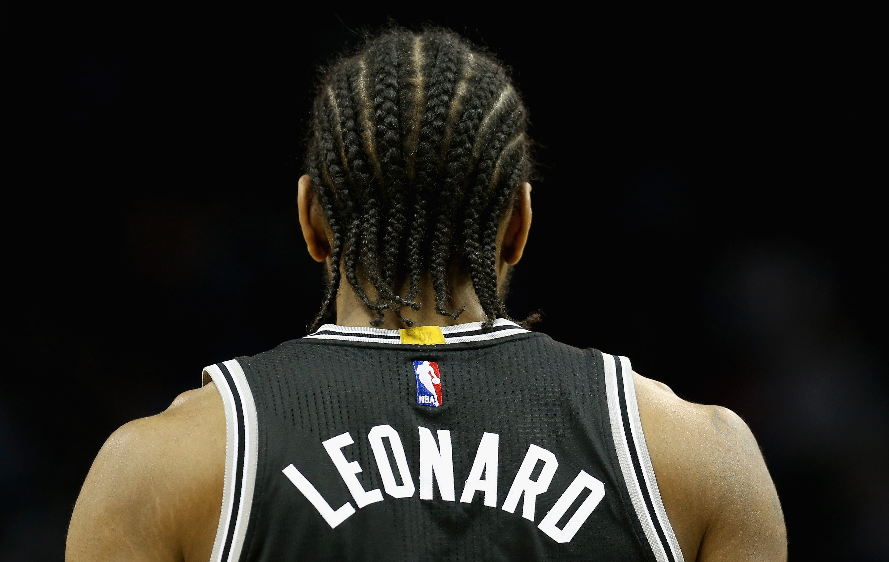 CHARLOTTE, NC - MARCH 21: Kawhi Leonard #2 of the San Antonio Spurs watches on against the Charlotte Hornets during their game at Time Warner Cable Arena on March 21, 2016 in Charlotte, North Carolina.NOTE TO USER: User expressly acknowledges and agrees that, by downloading and or using this photograph, User is consenting to the terms and conditions of the Getty Images License Agreement. (Photo by Streeter Lecka/Getty Images)