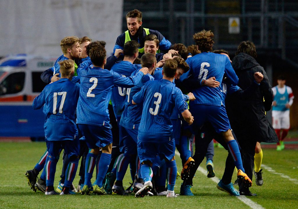 PADOVA, ITALY - MARCH 27: Paolo Ghiglione of Italy U19 is mobbed by team mates after scoring his team's opening goal during the UEFA European U19 Championship Elite Round match between Italy and Switzerland at Stadio Euganeo on March 27, 2016 in Padova, Italy. (Photo by Dino Panato/Getty Images)