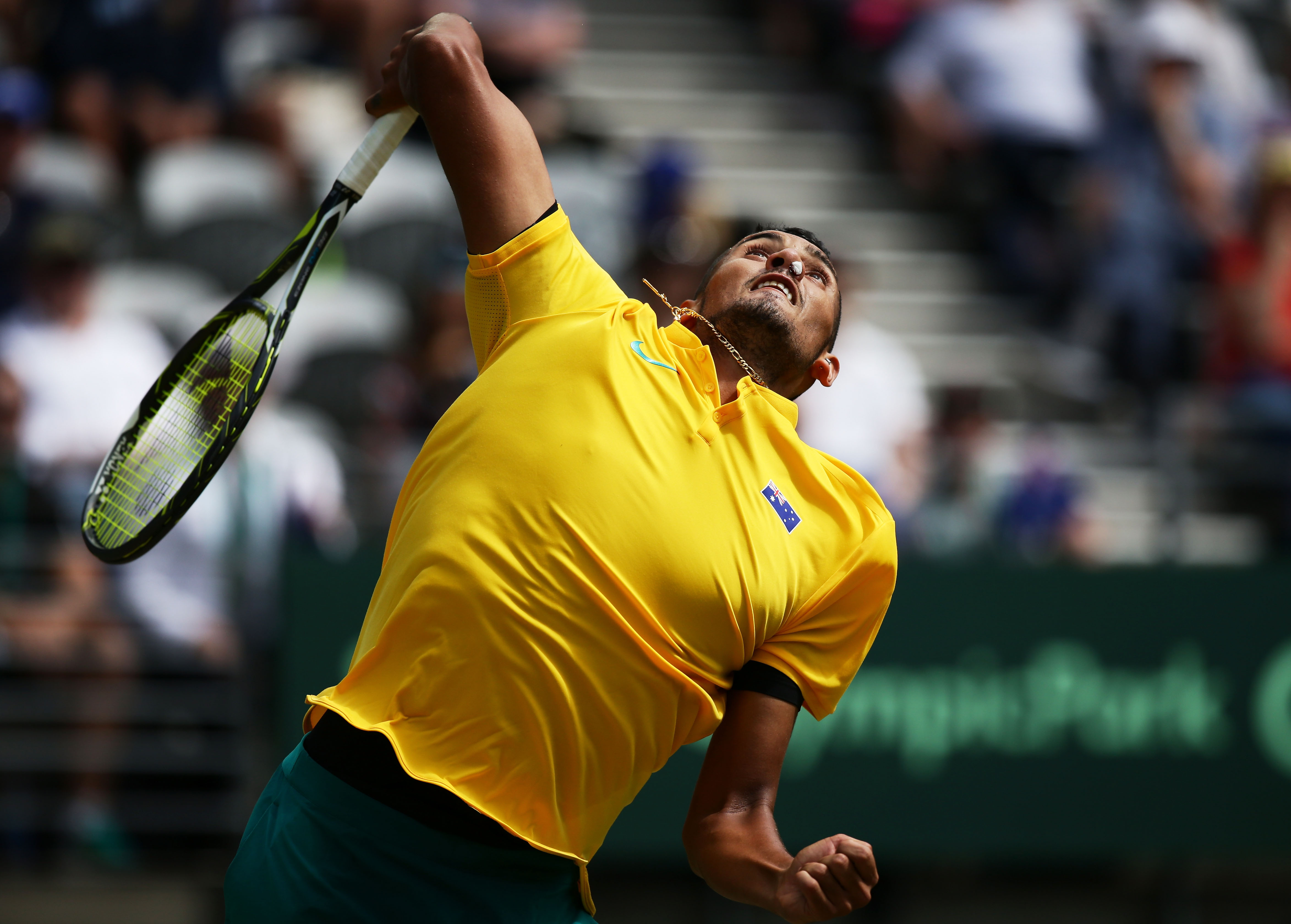 SYDNEY, AUSTRALIA - SEPTEMBER 16: Nick Kyrgios of Australia serves with his nose plugged due to a nose bleed in his singles match against Andrej Martin of Slovakia during the Davis Cup World Group playoff between Australia and Slovakia at Sydney Olympic Park Tennis Centre on September 16, 2016 in Sydney, Australia. (Photo by Matt King/Getty Images)