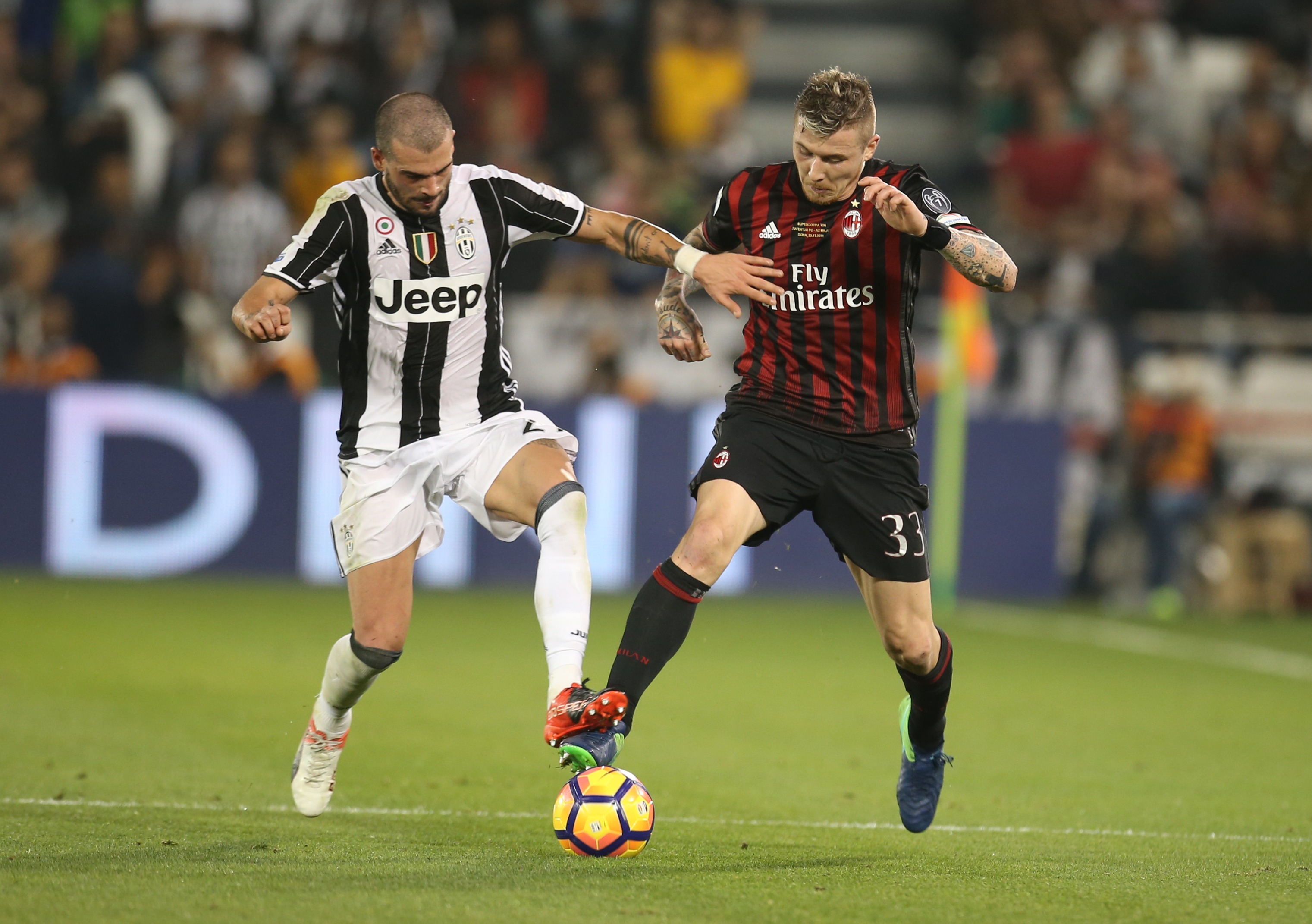 DOHA, QATAR - DECEMBER 23: Stefano Sturaro of Juventus FC in action against Juraj Kucka of AC Milan during the Supercoppa TIM Doha 2016 match between Juventus FC and AC Milan at the Jassim Bin Hamad Stadium on December 23, 2016 in Doha, Qatar. (Photo by AK BijuRaj/Getty Images)