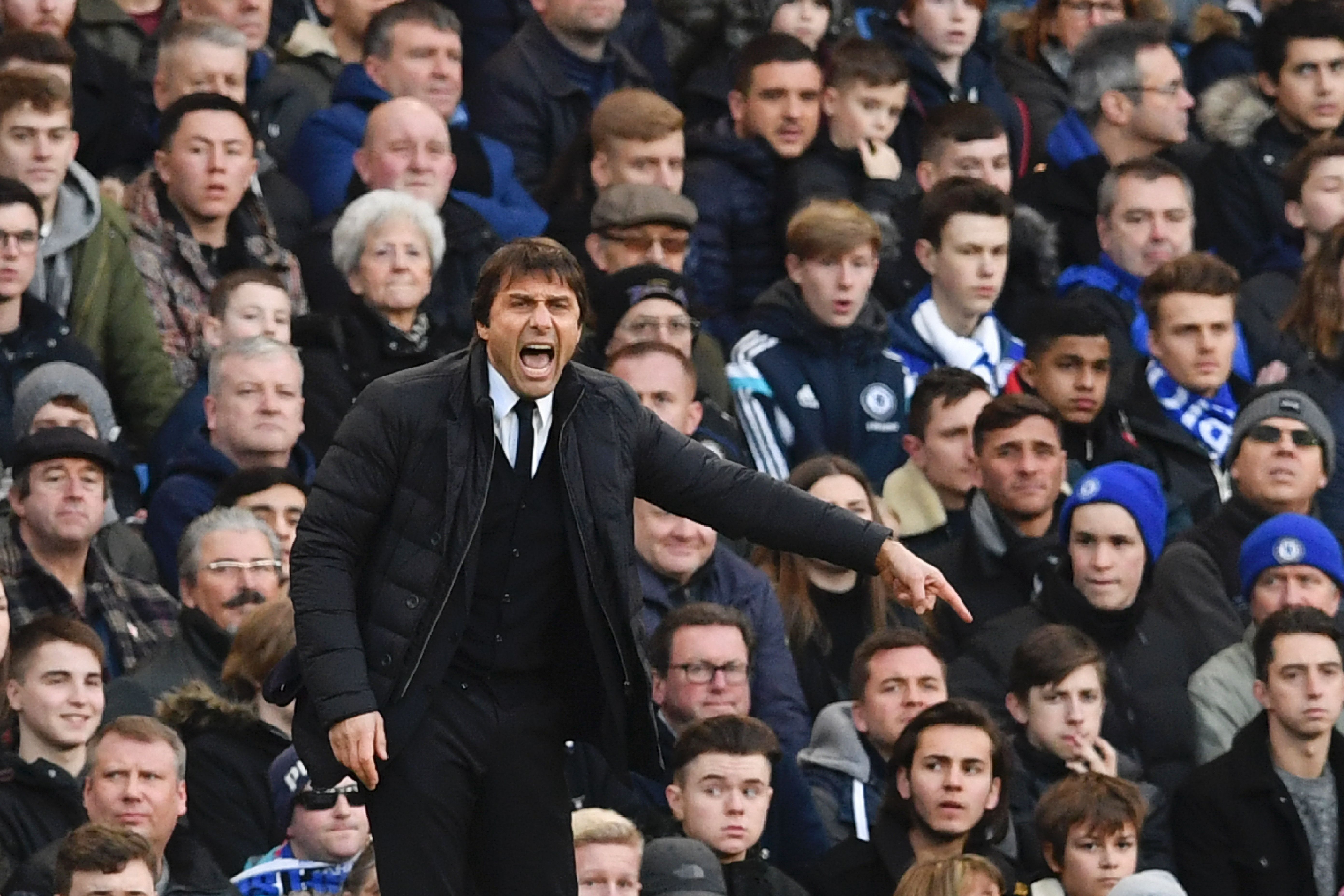 Chelsea's Italian head coach Antonio Conte gestures from the touchline during the English Premier League football match between Chelsea and Bournemouth at Stamford Bridge in London on December 26, 2016. / AFP / Ben STANSALL / RESTRICTED TO EDITORIAL USE. No use with unauthorized audio, video, data, fixture lists, club/league logos or 'live' services. Online in-match use limited to 75 images, no video emulation. No use in betting, games or single club/league/player publications. / (Photo credit should read BEN STANSALL/AFP/Getty Images)