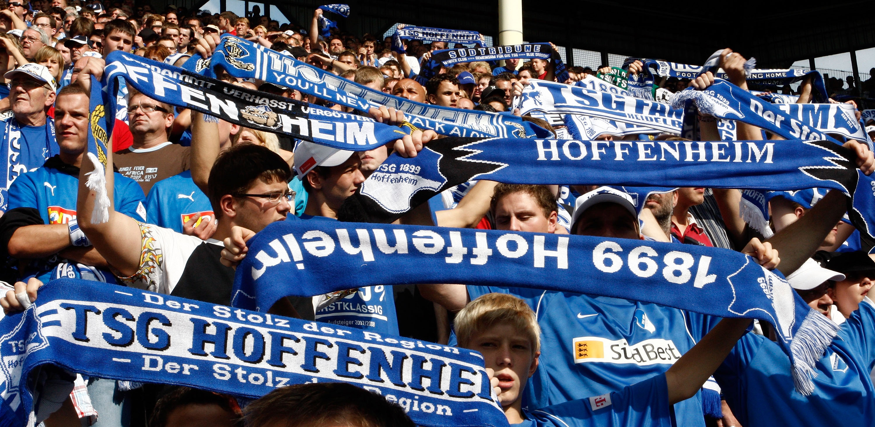 MANNHEIM, GERMANY - AUGUST 23: The Fans of TSG 1899 Hoffenheim celebrate after winning during the Bundesliga match TSG 1899 Hoffenheim against Borussia Moenchengladbach at the Carl Benz stadium in Mannheim on August 23, 2008 in Mannheim, Germany. (Photo by Thorsten Wagner/Bongarts/Getty Images)