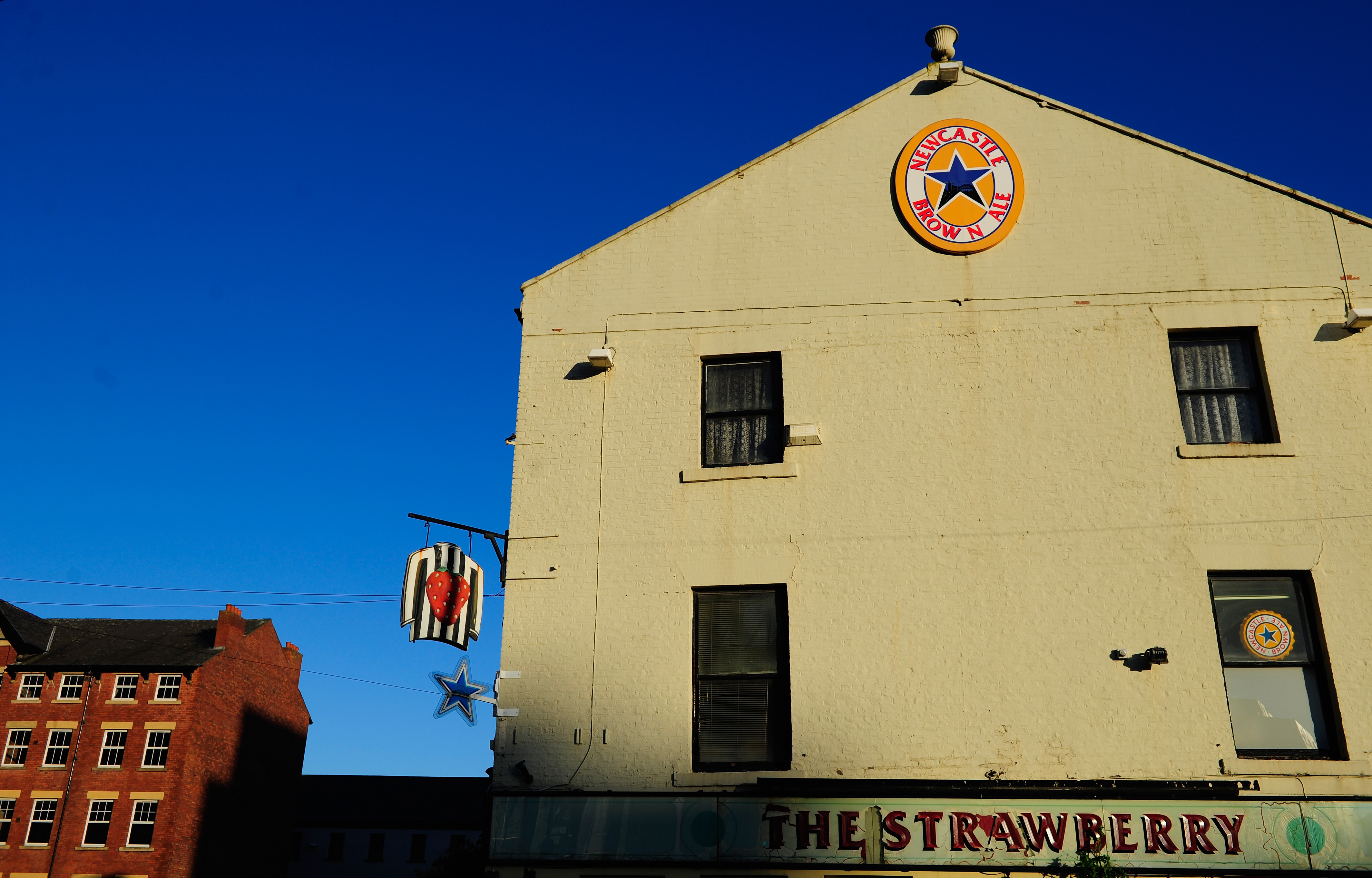 NEWCASTLE UPON TYNE, ENGLAND - DECEMBER 26: A close up of the famous 'Strawberry' Pub before the Barclays Premier League match between Newcastle United and Stoke City at St James' Park on December 26, 2013 in Newcastle upon Tyne, England. (Photo by Stu Forster/Getty Images)