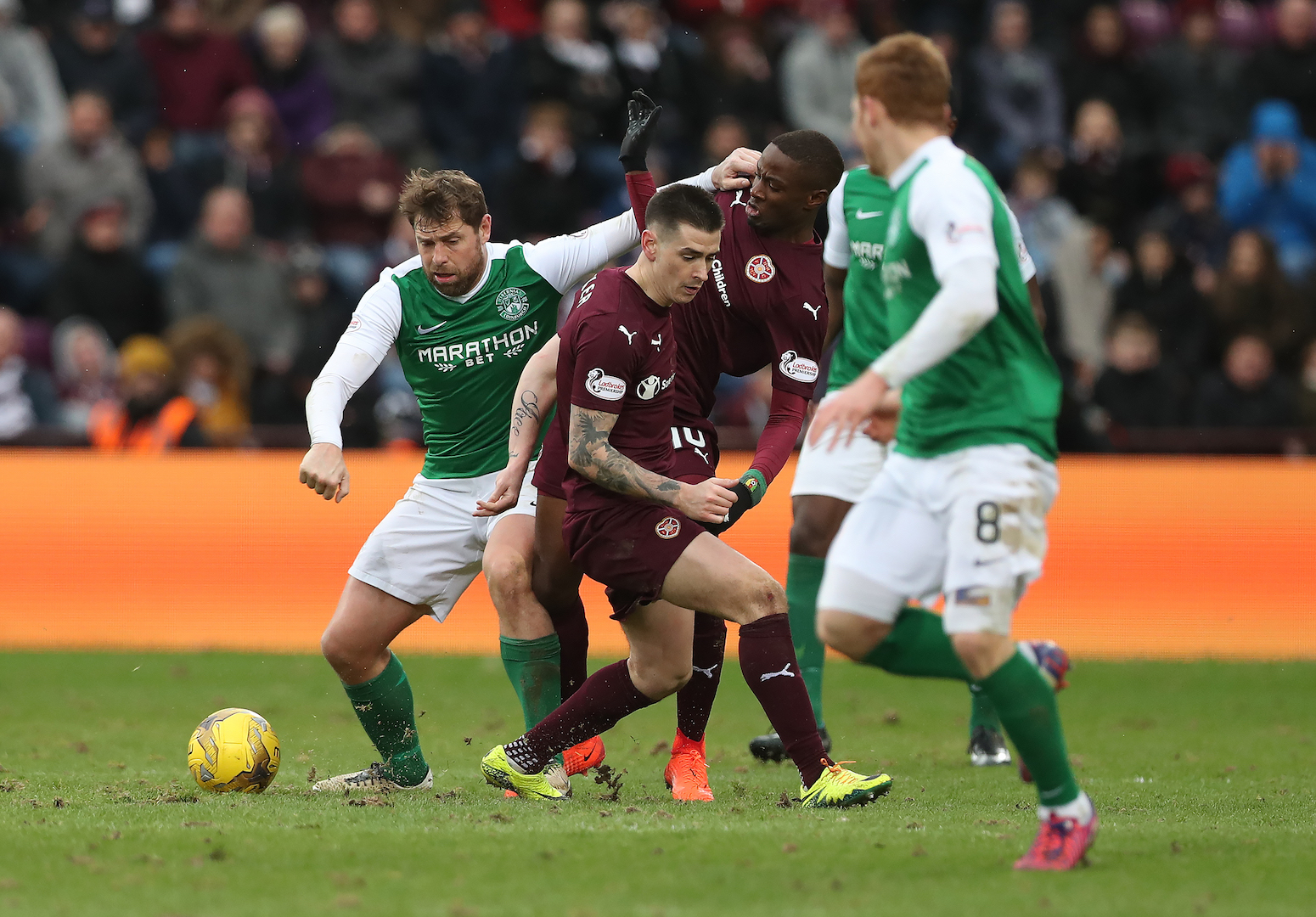 EDINBURGH, SCOTLAND - FEBRUARY 12: Esmael Goncalves of Heart of Middlothian vies with Grant Holt of Hibernian during the Scottish Cup Fifth Round match between Heart of Midlothian and Hibernian at Tynecastle Stadium on February 12, 2017 in Edinburgh, Scotland. (Photo by Ian MacNicol/Getty Images)