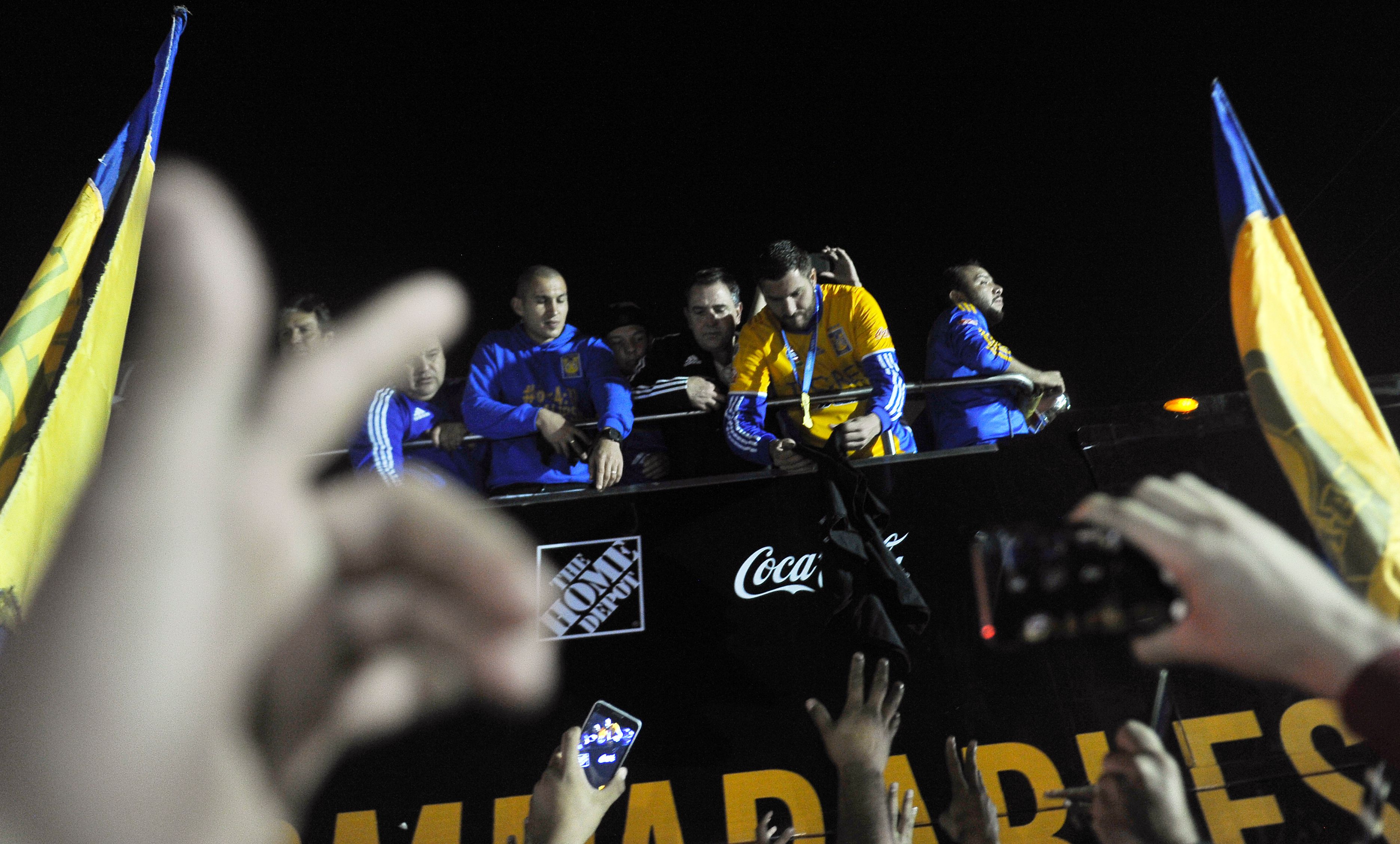 Players of Tigres celebrate with fans their victory against America in the final of the Mexican Apertura 2016 tournament football match at the Universitario stadium, in Monterrey, on December 25, 2016. / AFP / PEDRO PARDO (Photo credit should read PEDRO PARDO/AFP/Getty Images)