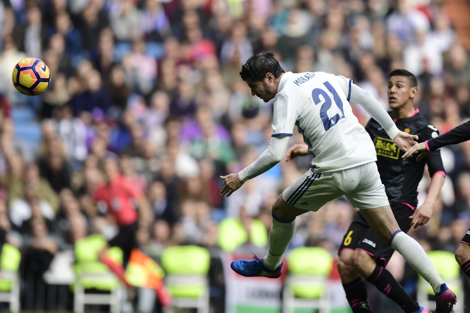 Real Madrid's forward Alvaro Morata (L) heads the ball to score a goal during the Spanish league football match Real Madrid CF vs RCD Espanyol at the Santiago Bernabeu stadium in Madrid on February 18, 2017. / AFP / JAVIER SORIANO (Photo credit should read JAVIER SORIANO/AFP/Getty Images)