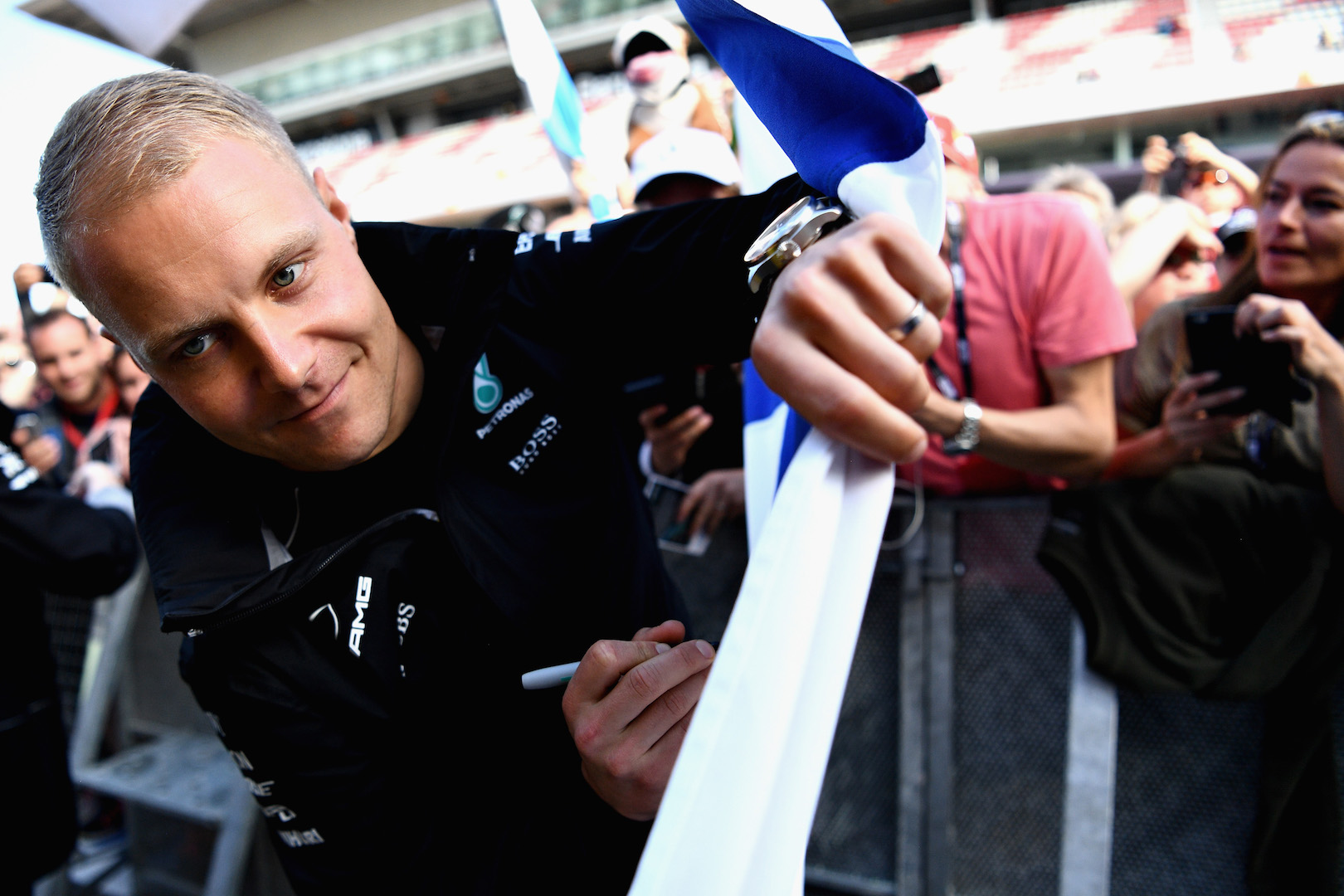 MONTMELO, SPAIN - MAY 11: Valtteri Bottas of Finland and Mercedes GP signs autographs for fans during previews for the Spanish Formula One Grand Prix at Circuit de Catalunya on May 11, 2017 in Montmelo, Spain. (Photo by David Ramos/Getty Images)