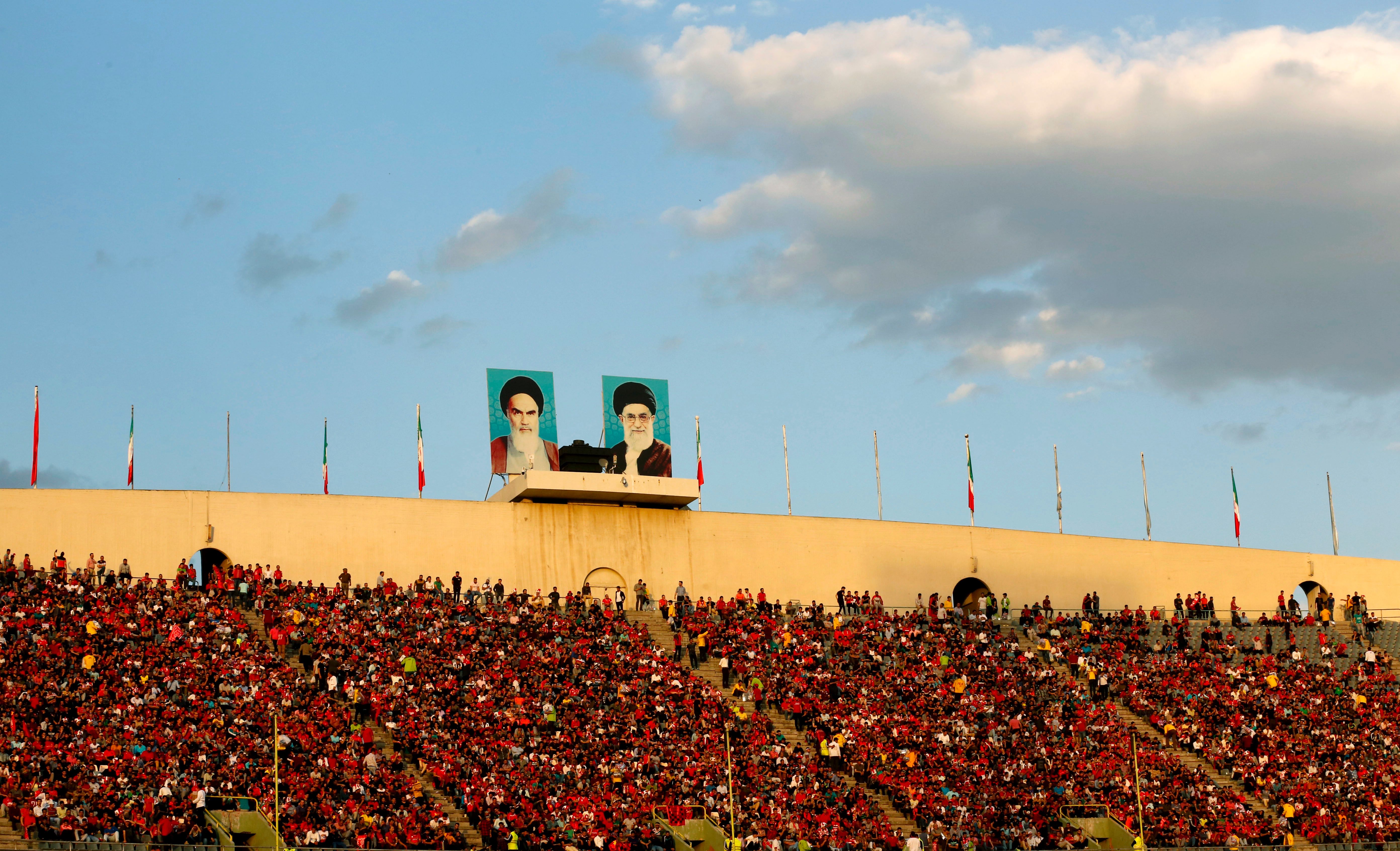 Persepolis fans cheer during the Asian Champions League football match between UAE's Al-Wahda and Iran's Persepolis at the Azadi Stadium in Tehran on May 8, 2017. / AFP PHOTO / ATTA KENARE (Photo credit should read ATTA KENARE/AFP/Getty Images)