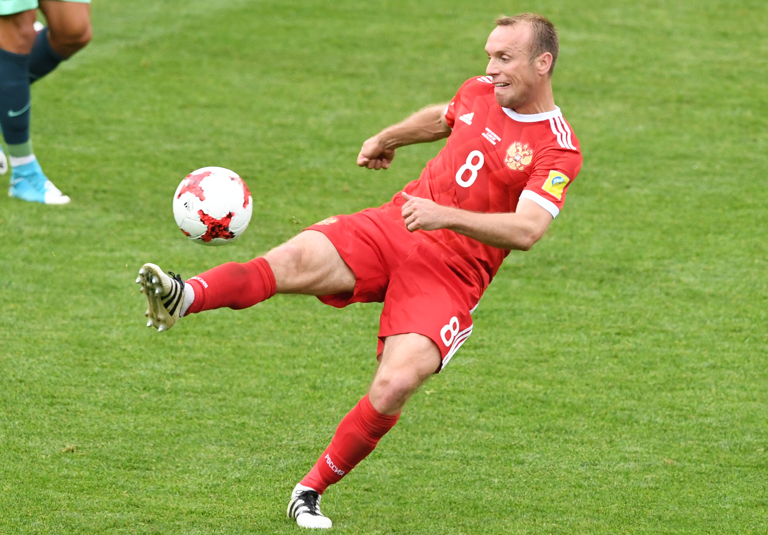 Russia's midfielder Denis Glushakov controls the ball during the 2017 Confederations Cup group A football match between Russia and Portugal at the Spartak Stadium in Moscow on June 21, 2017. / AFP PHOTO / Yuri KADOBNOV (Photo credit should read YURI KADOBNOV/AFP/Getty Images)