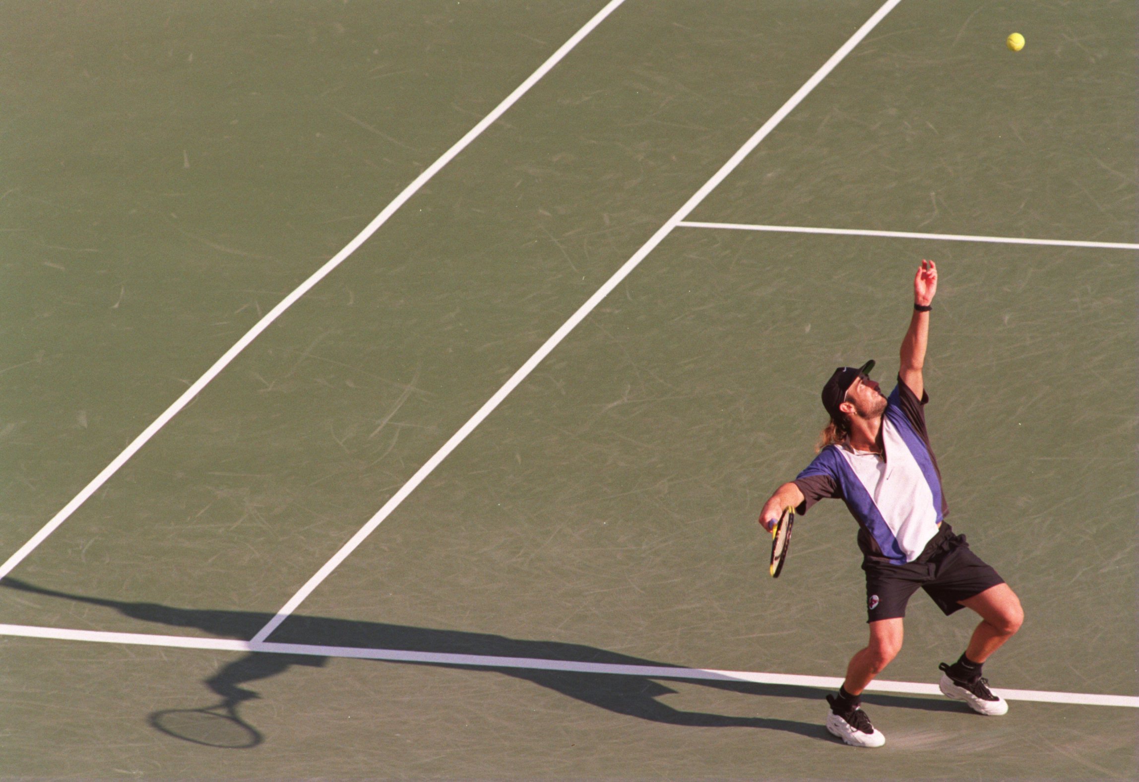 5 Sep 1994: ANDRE AGASSI SERVES UP A DEFEAT FOR MICHAEL CHANG IN THE FOURTH ROUND OF THE US OPEN IN FLUSHING MEADOWS, NEW YORK .