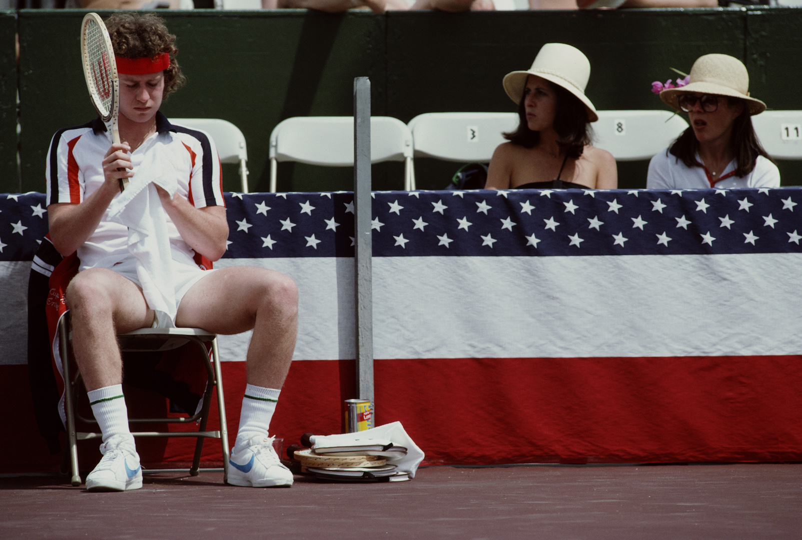 Two female spectators looking at John McEnroe of the United States during the Alan King Tennis Classic on 23 April 1979 at Las Vegas, Nevada, United States. (Photo by Tony Duffy/Getty Images)