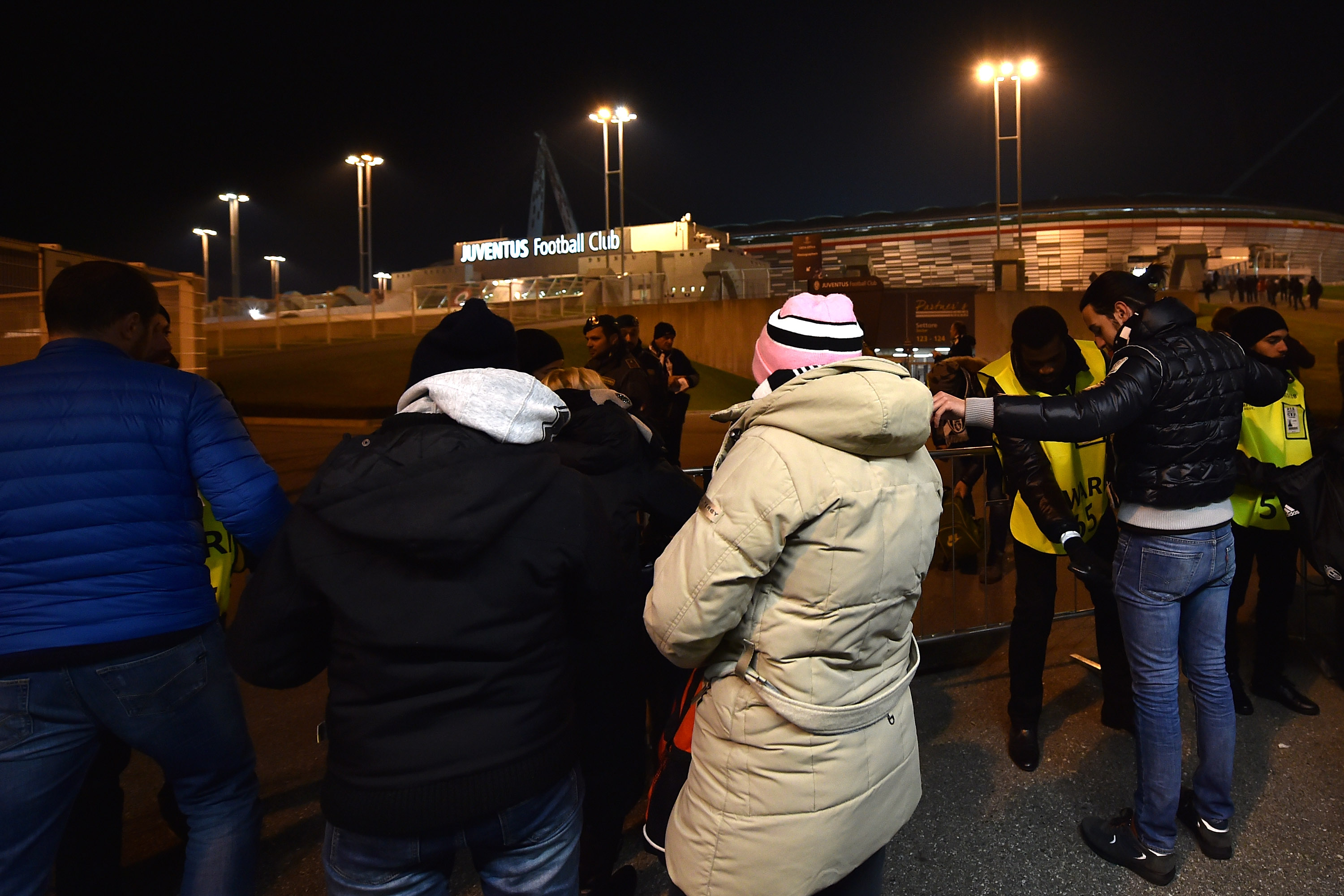 TURIN, ITALY - NOVEMBER 25: Spectators are checked by security guards before they get in to the stadium before the UEFA Champions League group stage match between Juventus and Manchester City FC at Juventus Arena on November 25, 2015 in Turin, Italy. (Photo by Valerio Pennicino/Getty Images)