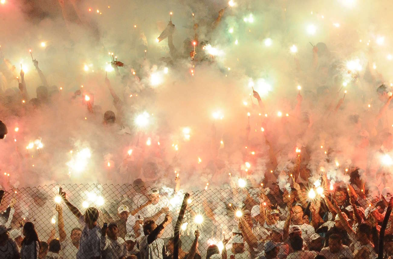 Santos fans celebrate before their match