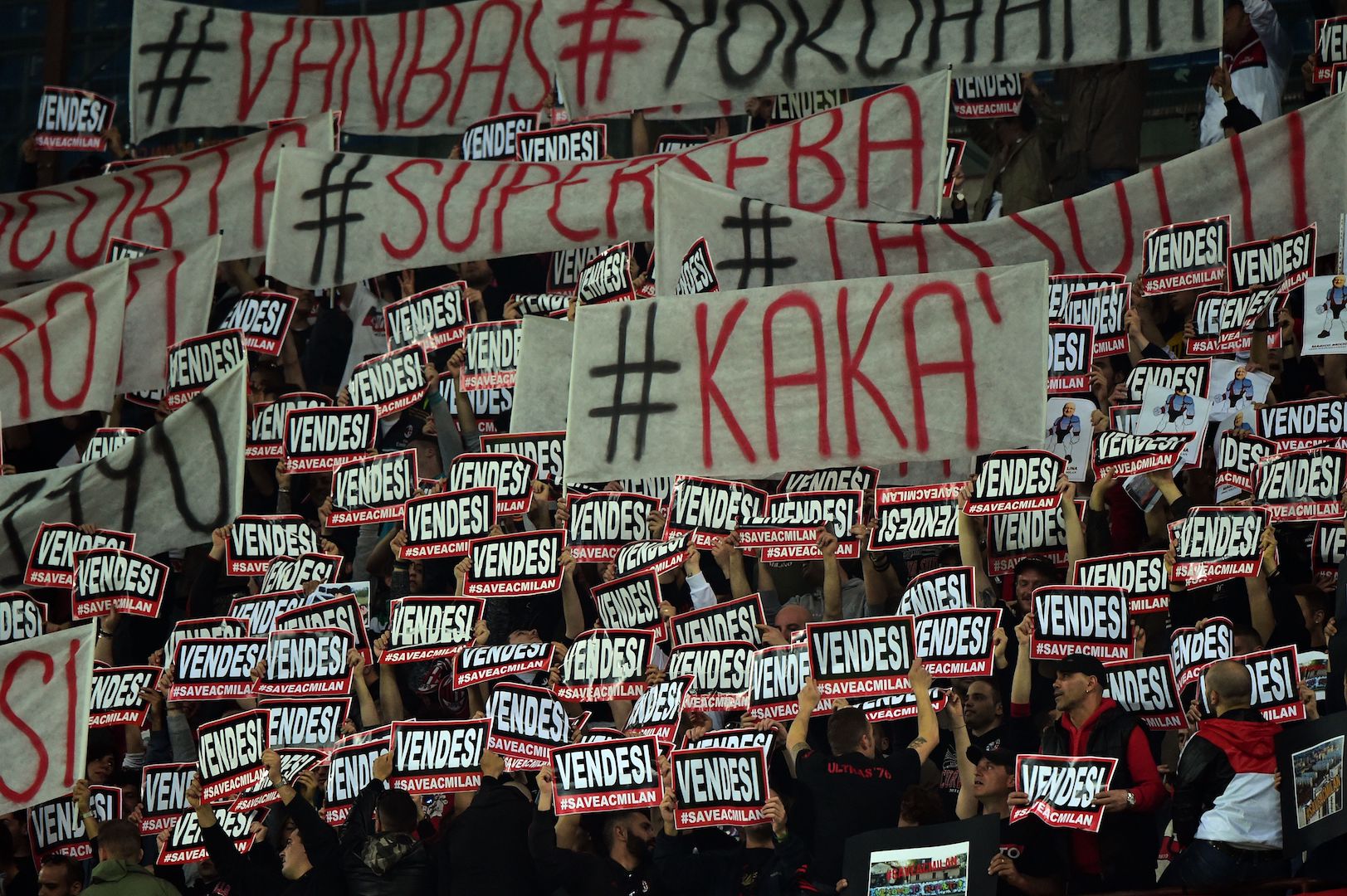 AC Milan's supporters hold posters reading "Vendesi" (for sale) and a flag reading "Kaka" during the Italian Serie A football match between AC Milan and Sampdoria at San Siro Stadium in Milan on April 12, 2015. AFP PHOTO / GIUSEPPE CACACE (Photo credit should read GIUSEPPE CACACE/AFP/Getty Images)