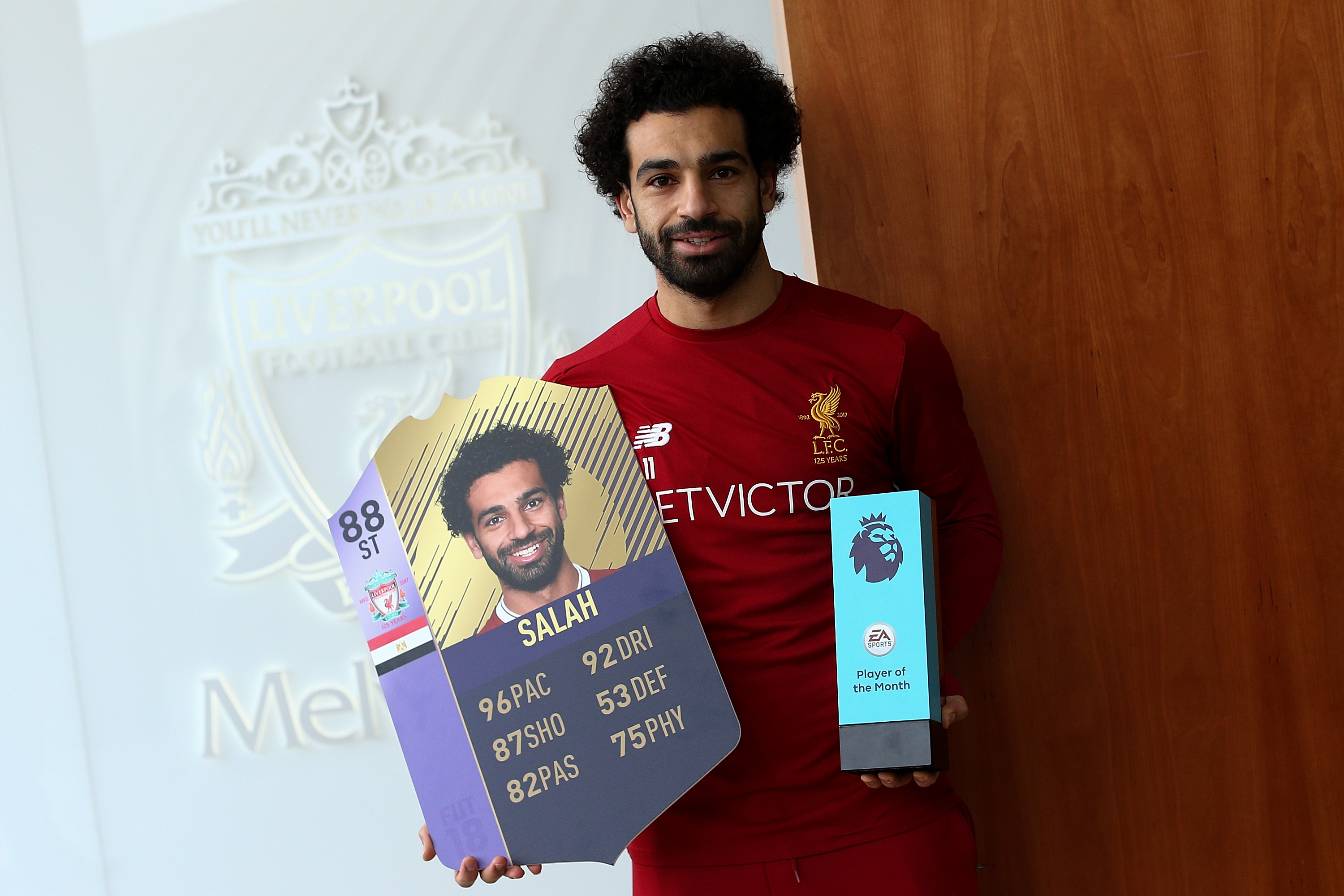 LIVERPOOL, ENGLAND - DECEMBER 14: Mohamed Salah is Awarded the EA SPORTS Player of the Month for November at Melwood Training Ground on December 14, 2017 in Liverpool, England. (Photo by Jan Kruger/Getty Images for Premier League)