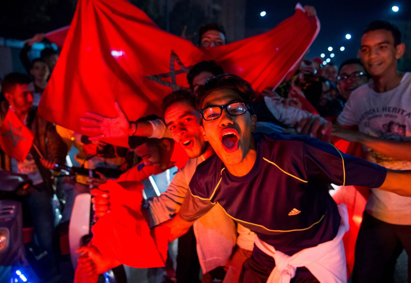 Moroccans celebrate November 11, 2017 in Marrakech following Morocco's victory over Ivory Coast in their FIFA 2018 World Cup Africa Qualifier to participate the FIFA 2018 World Cup. / AFP PHOTO / Fadel SENNA (Photo credit should read FADEL SENNA/AFP/Getty Images)