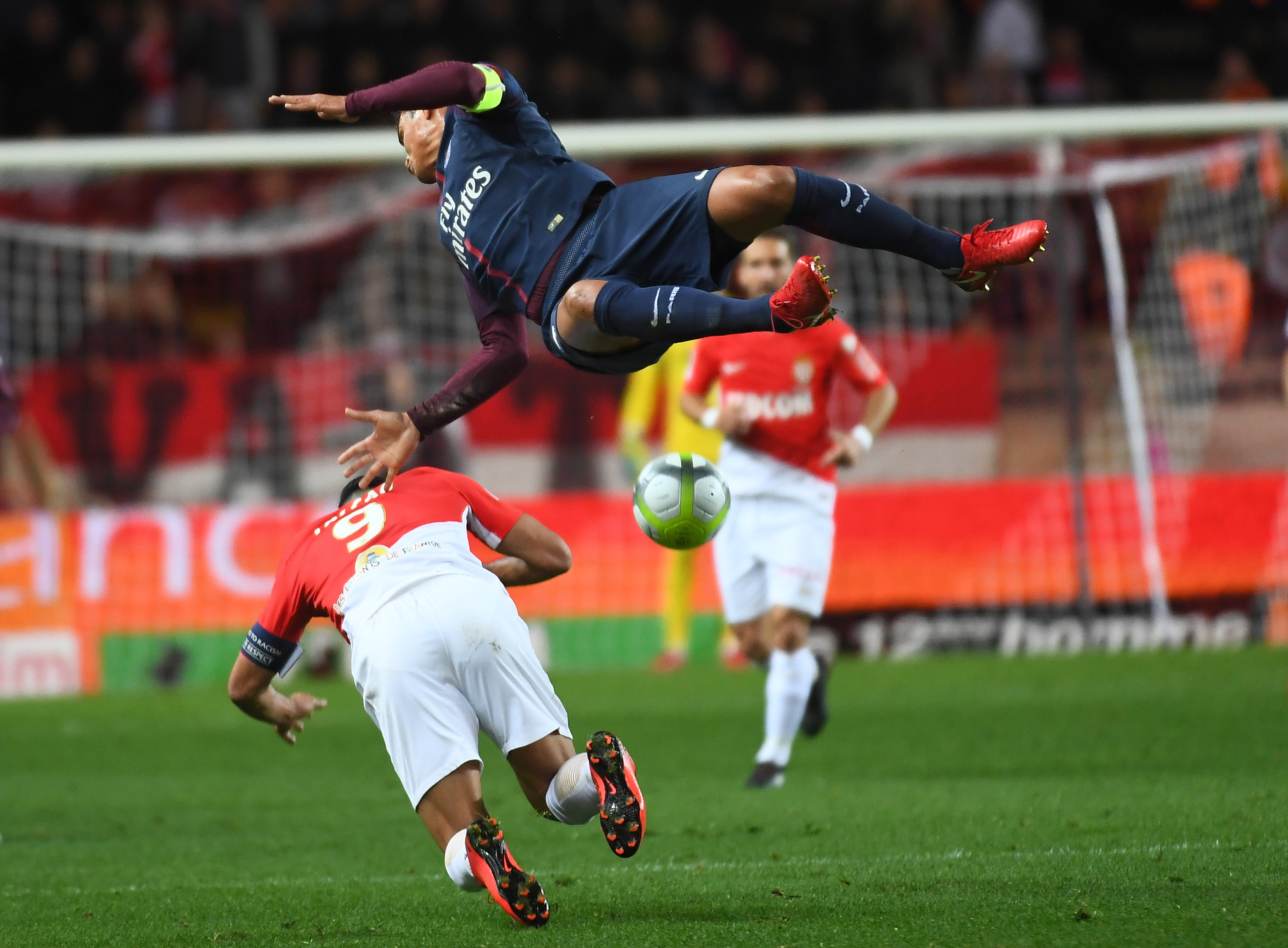 TOPSHOT - Paris Saint-Germain's Brazilian defender Thiago Silva (up) vies for the ball with Monaco's Colombian forward Radamel Falcao (L) during the French L1 football match between Monaco and Paris Saint-Germain (PSG) at the Louis II stadium, in Monaco, on November 26, 2017. / AFP PHOTO / ANNE-CHRISTINE POUJOULAT (Photo credit should read ANNE-CHRISTINE POUJOULAT/AFP/Getty Images)